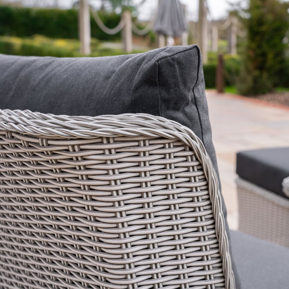 Talia L-Shaped Grande Rattan Dining Set with Reclining Armchair & Bench - Rising Table