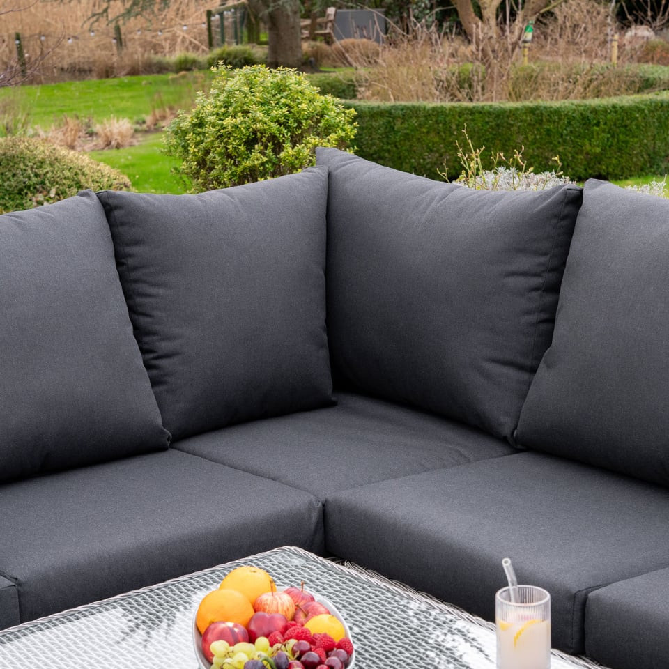 Talia L-Shaped Grande Rattan Dining Set with Reclining Armchair & Bench - Rising Table